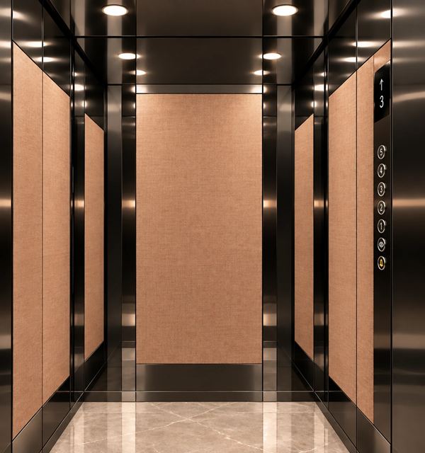 Copper Noir cabin: rose gold linen panels framed in black mirror, black mirror ceiling with downlights, beige marble floor