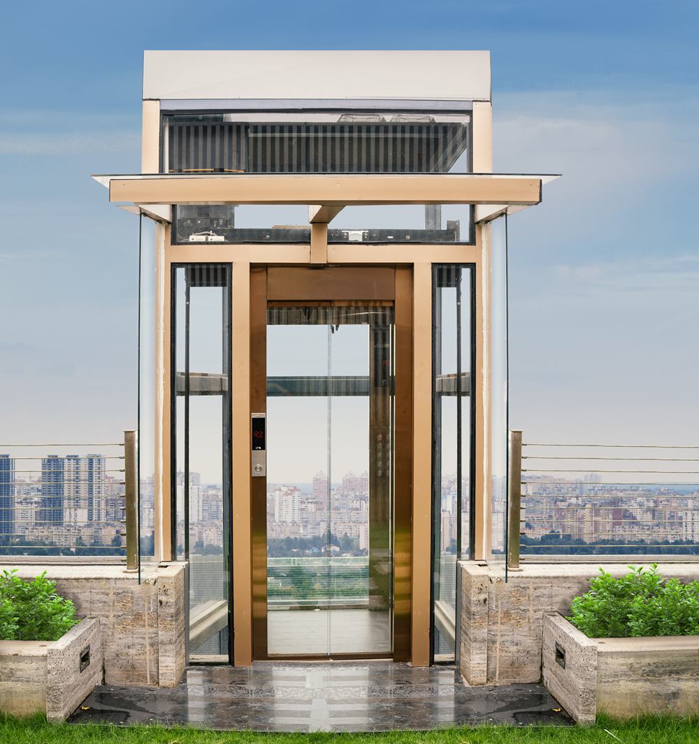 Glass home-lift pavilion on a rooftop terrace